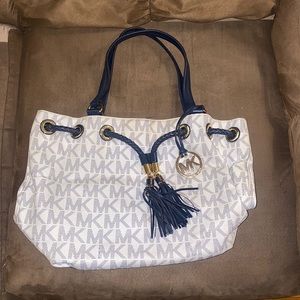 Michael Kors bag. Cute white/navy color. Used but in great condition